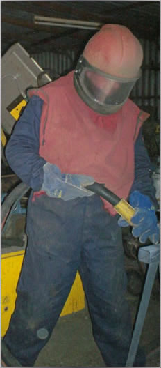 Photograph of Glynn shotblasting